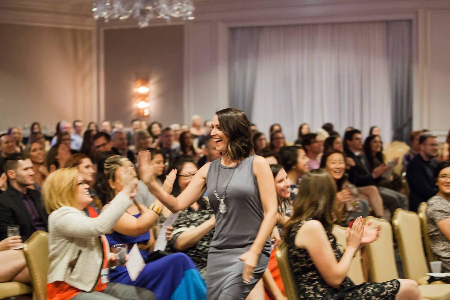 Audience celebrating an award win